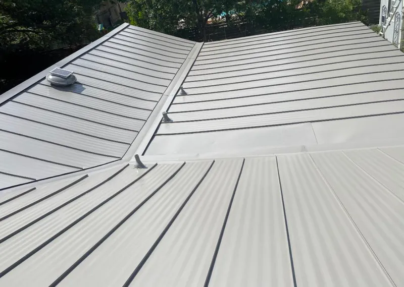 Solar attic fan installed on a metal roof for Roof Ventilation in Mount Clemens